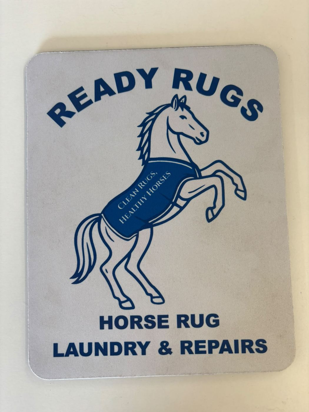 Mouse mat printed with the Ready Rugs logo