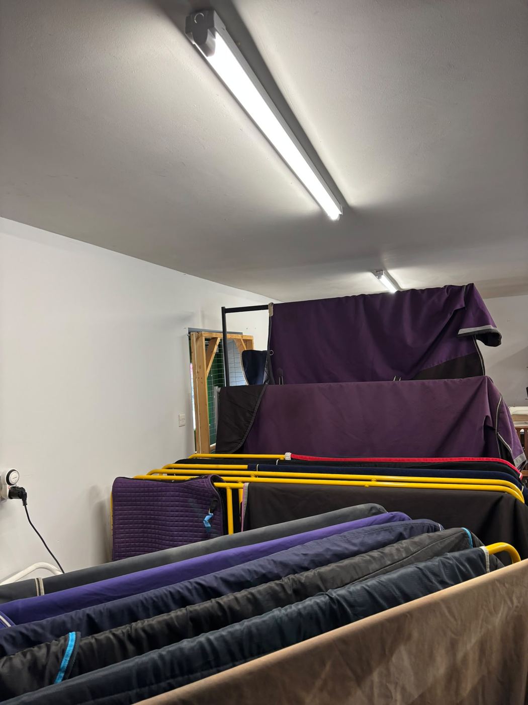 Clean rugs drying in the workshop
